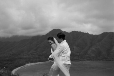 groom hugging bride