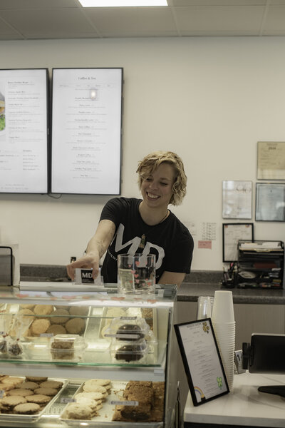 Employee at the bakery counter at Mason Dixon
