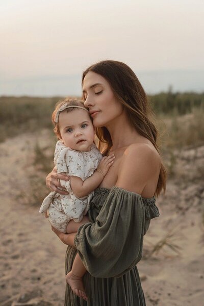 Mother holding her baby captured by photographers in Traverse City MI

