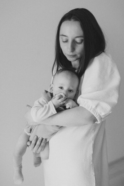 Mother holding her child at home in Helsinki