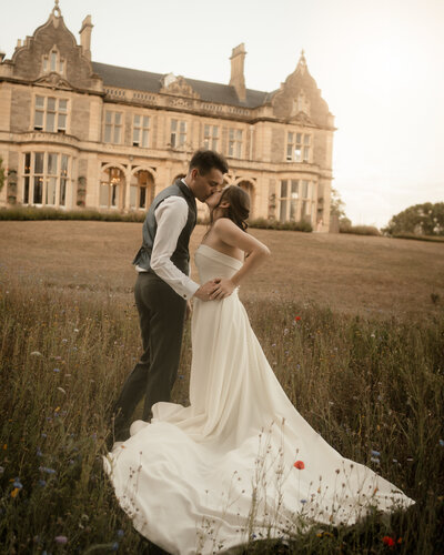 Couple getting married at large manor house