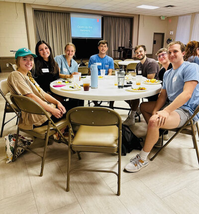 group of students sitting at table