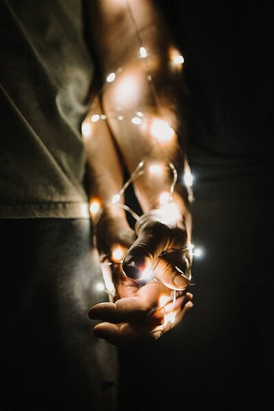night twinkle light holding hands