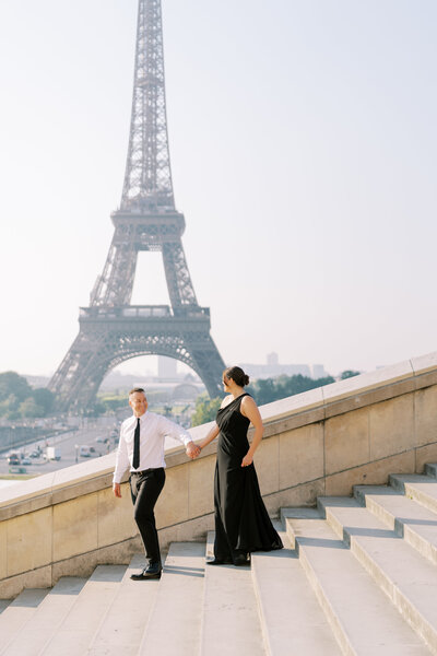 couple in front of eiffel tower