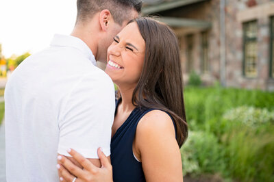 milwaukee engagement photography of groom picking up bride