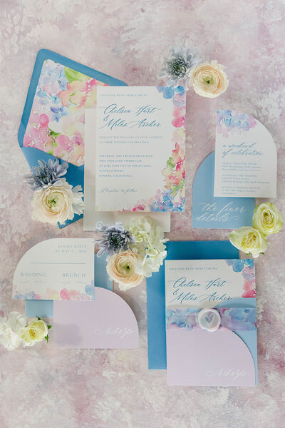 Romantic watercolor wedding invitation suite with blush tones