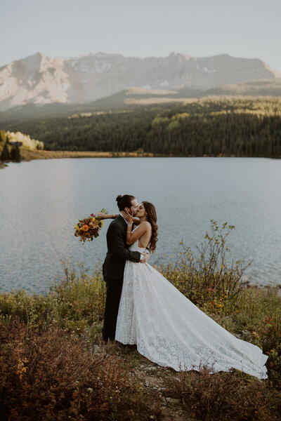 Couple kisses at Trout Lake in Telluride