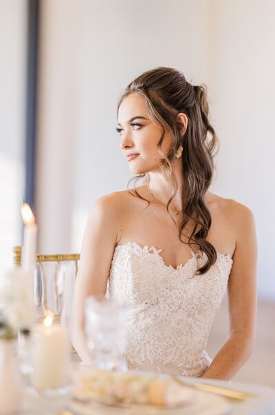 A bride and groom pose with each other after their first look.