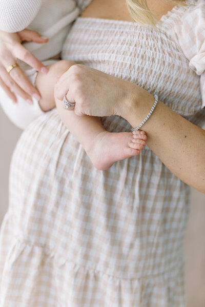 maternity photo of mom holding child