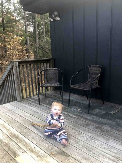 two black chairs on a wooden deck