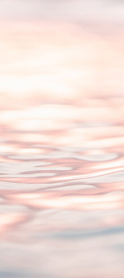 close up photo of water surface. Pink hues, dreamy