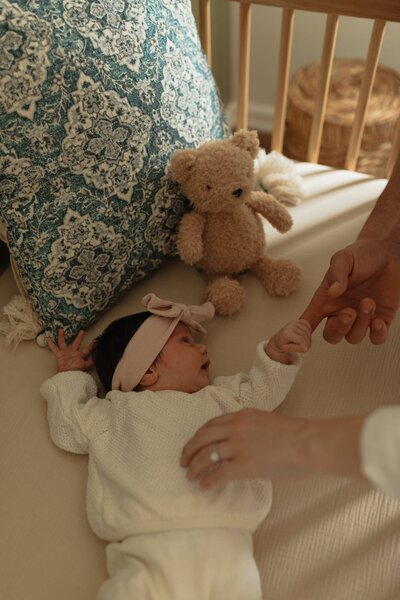 mom and dad cuddling baby for newborn lifestyle session in pei