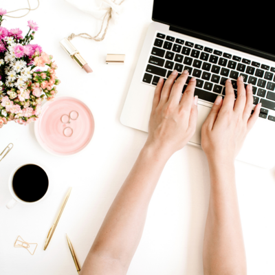 TWO WOMAN HAVING CONVERSATION IN OFFICE NEAR LAPTOP