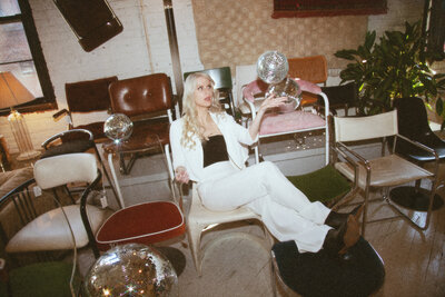 Women on couch with disco ball