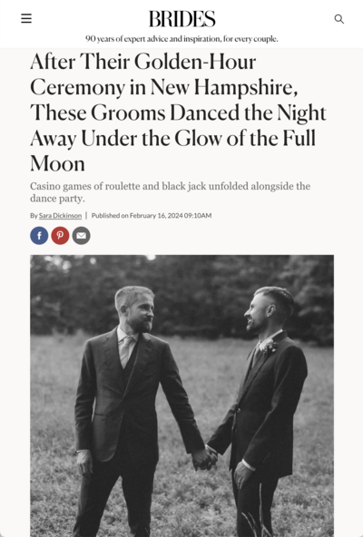 Two grooms in suits dance joyfully under a full moon at their outdoor wedding ceremony in New Hampshire.