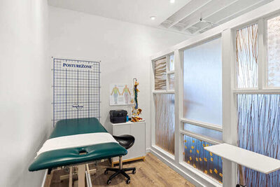 Consultation room with desk, chairs, and welcoming atmosphere