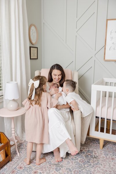Portrait of mother kissing her newborn baby's cheek-Newborn Photography Greenville SC