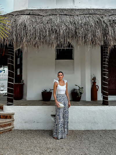 ABL dressed for dinner in vacation print pants and cream top in Akumal Mexico @amalynstyle and @amalynsocial 