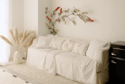 Studio image rocking horse in front of white bed in boho background in Tampa Bay, Florida Nadine B Photography