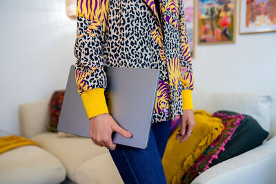 Designer carrying laptop - Create & Wander