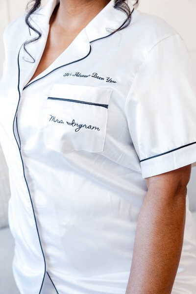 Elegant bridal pajama set with embroidered details for a luxurious wedding day preparation.