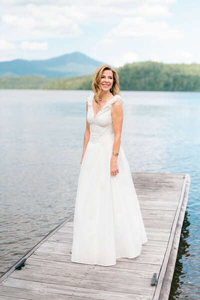 lake placid lodge wedding with the bride getting ready in the suite and then portraits on the dock