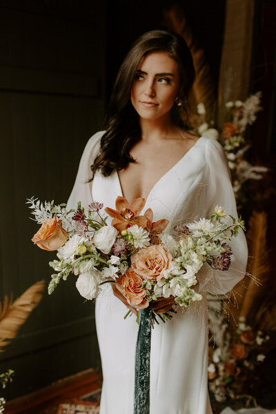 bride holding flowers posing