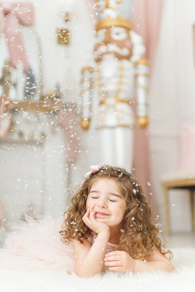 Girl with her eyes closed dreaming of magic in a Nutcracker themed mini session