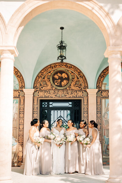 Palm Beach Wedding Photographer captures bride with her bridesmaids at the society of the four arts in west palm beach