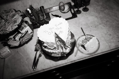 black and white wedding cake to the ends of the earth messy table