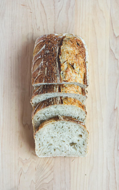 Aromatic rosemary garlic artisan sourdough, perfect for savory meals.