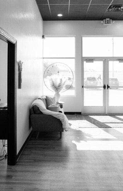 Lavender & Ink Studios entrance area with seating and glass doors at 3851 Algoma Road, New Franken, WI