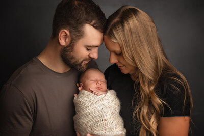 Newborn boy sleeping peacefully during his baby photo session in Minnesota.