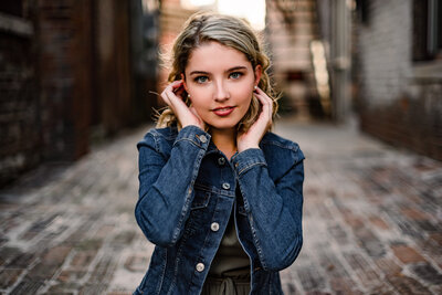 girl sitting on steps with foot in front