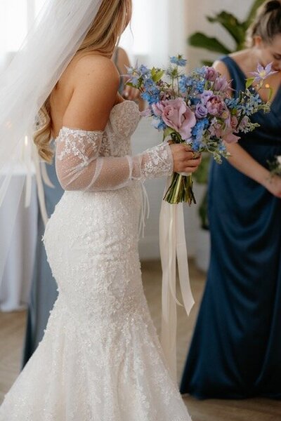 Bride holding bouquet.