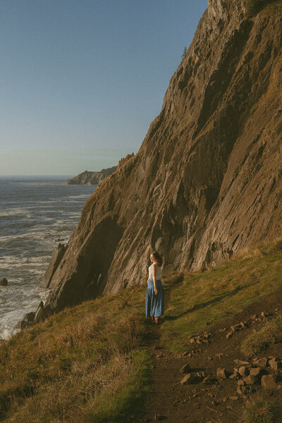 girl sitting with dog at oregon coast