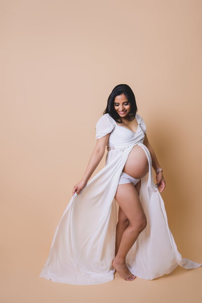 Graceful maternity portrait with flowing gown — luxury Bay Area pregnancy photography