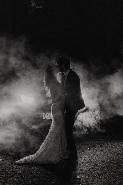 Couple kissing under a cave