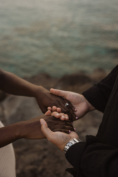 holding hands with wedding ring