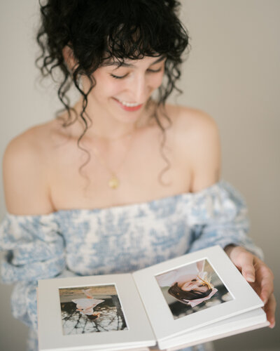huntsville alabama photographers  wearing dress holding heirloom matted album