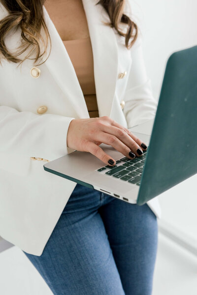 Nickie Kehoe typing on a laptop