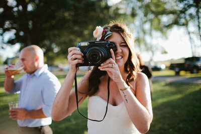 Bride holding up camera