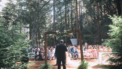 Scenic wedding ceremony at Water Fall Lodge, Santa Cruz, California.