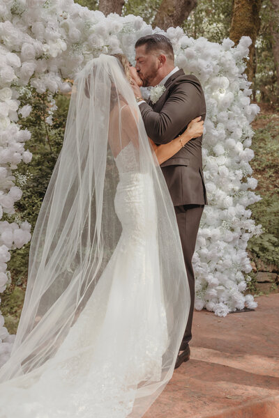 A couple share an intimate at their ceremony in placerville