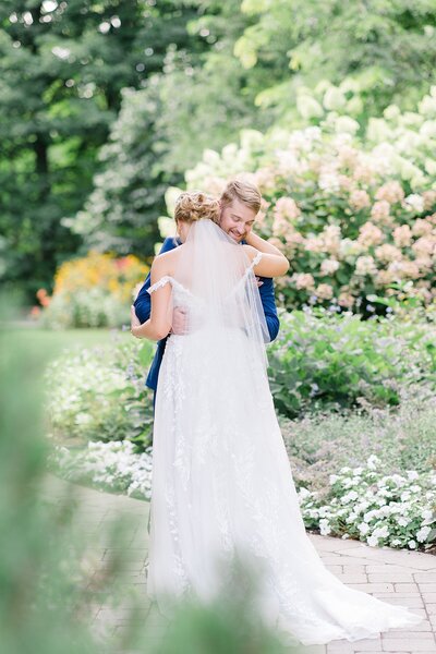 Bride and groom hugging in the garden at Temple's Country Weddings