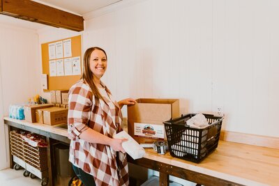 Person packing grocery orders in boxes