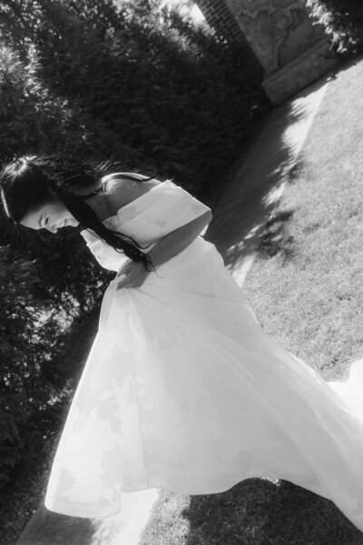 bride smilingnholding her dress and running 