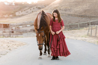 Horse and Rider standing side by side for portrait in Monterey County