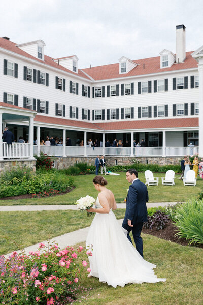 Wedding couple walking the grounds at a beach resort on the East Coast