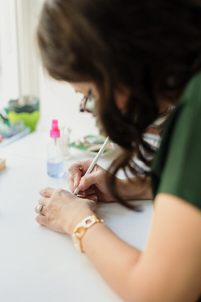 Person Writing Calligraphy